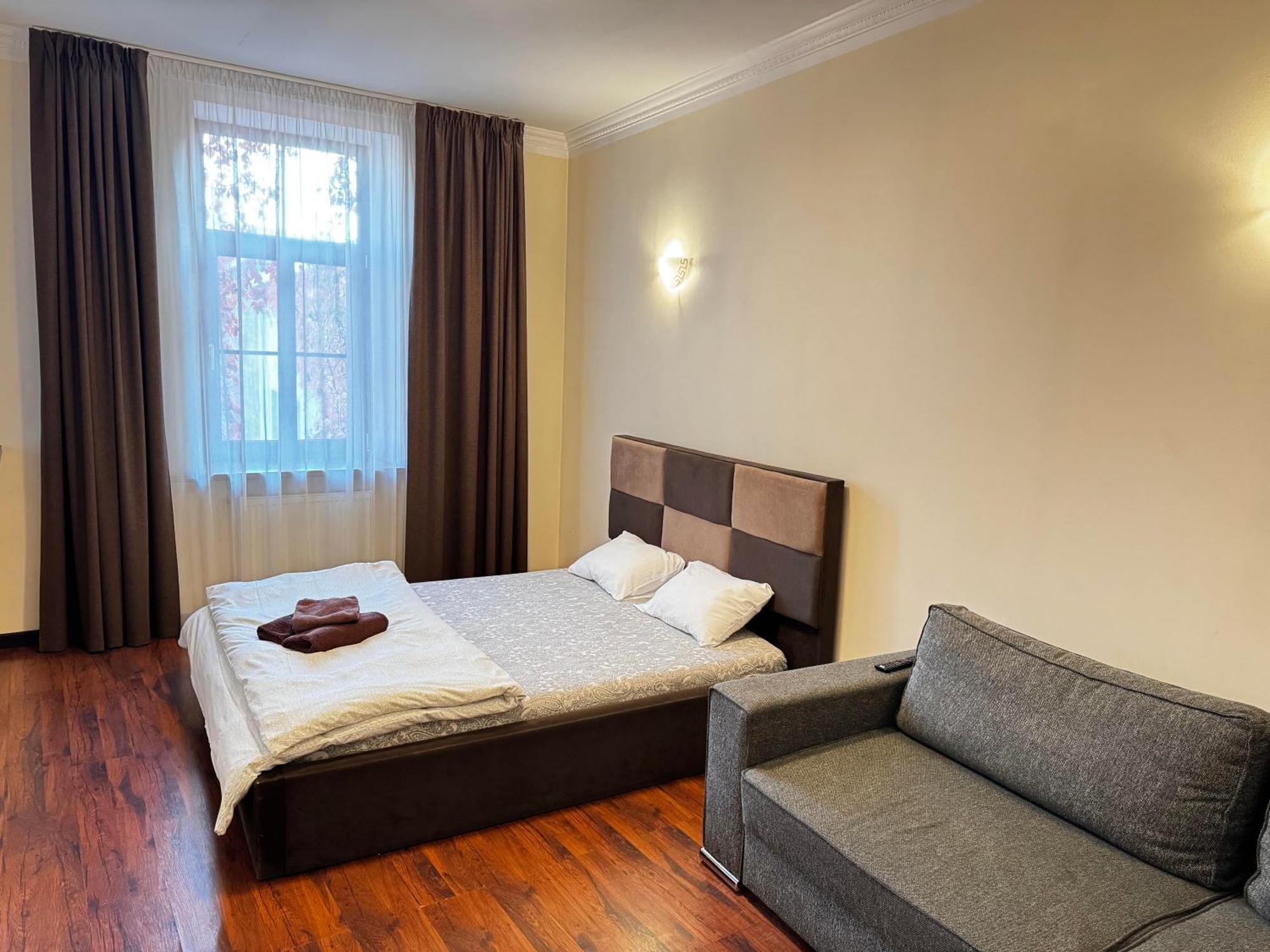 Aparthotel Рига Экстерьер фото A bedroom in a hotel