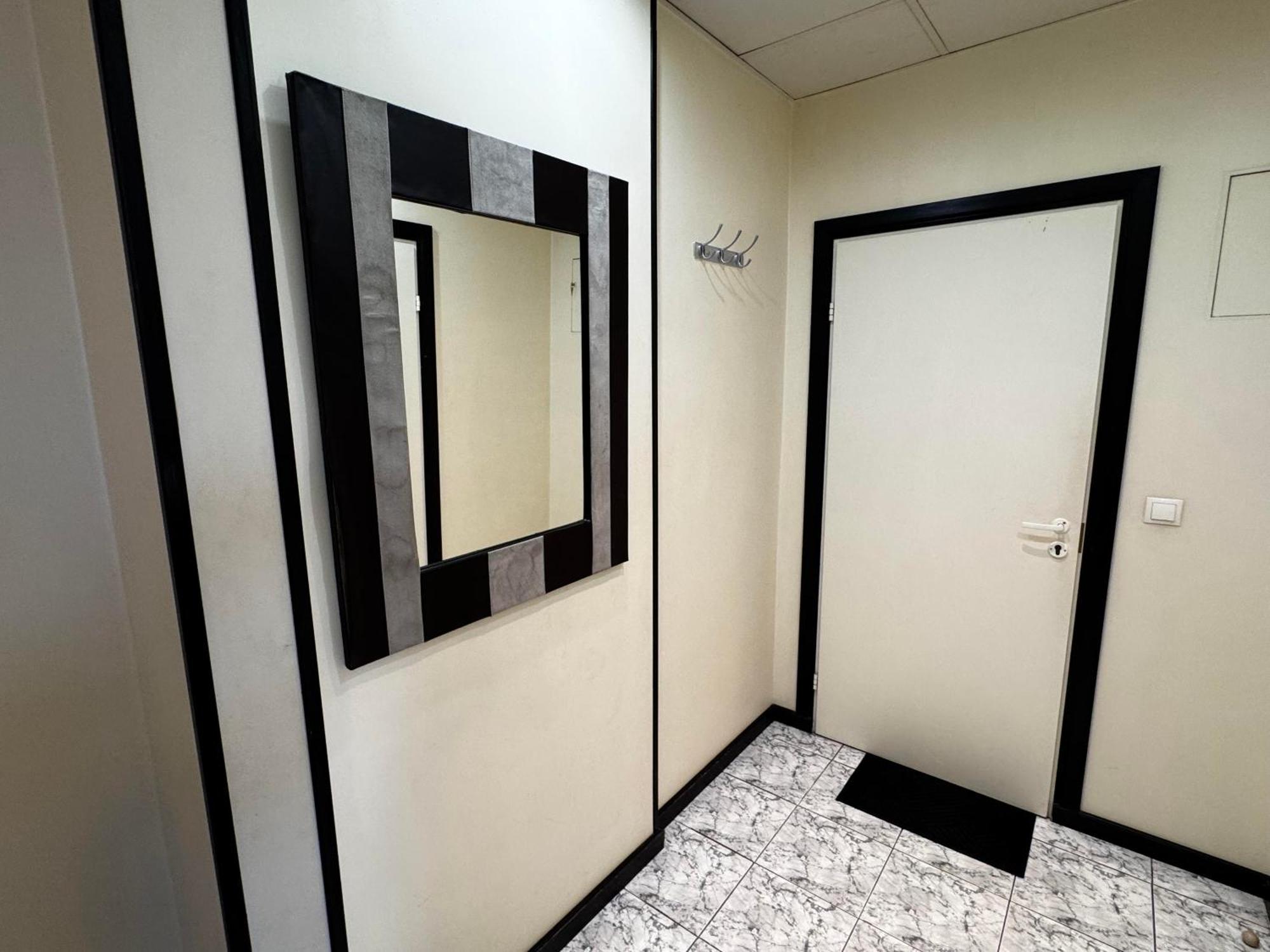 Aparthotel Рига Экстерьер фото A mirror in a bathroom